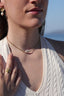 Collier Nerina en acier inoxydable doré avec une perle d’eau douce centrale