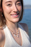 Collier Calypso – Perles d’eau douce et acier inoxydable doré