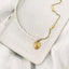 Collier Mila en acier inoxydable doré et perles de culture.