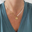 Collier Mila en acier inoxydable doré et perles de culture.