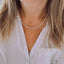 Collier Maïa – Perles de culture irrégulières 2-3 mm et pendentif doré au choix