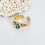 Bague en acier inoxydable doré avec pierre naturelle verte malachite.